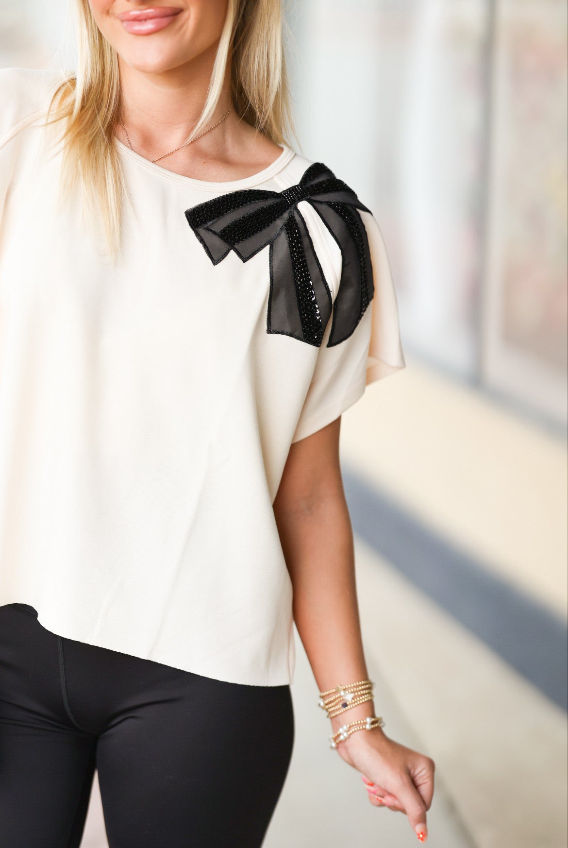 black bow tan top